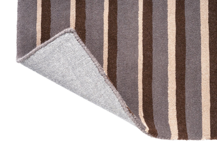 Brink & Campman Decor Pilar Taupe tapijt, detail van omgeslagen hoek en rug