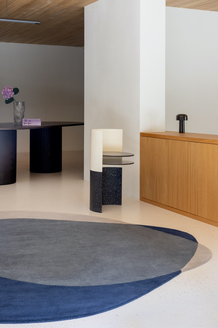 Brink & Campman Element Arp Blue rug styled in modern minimalist living room