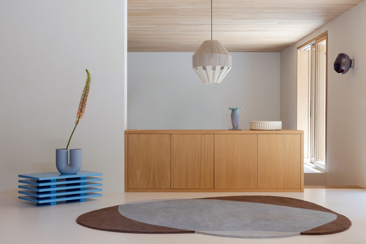 Element Chad Brown Blue rug enhancing a minimalist bedroom setting