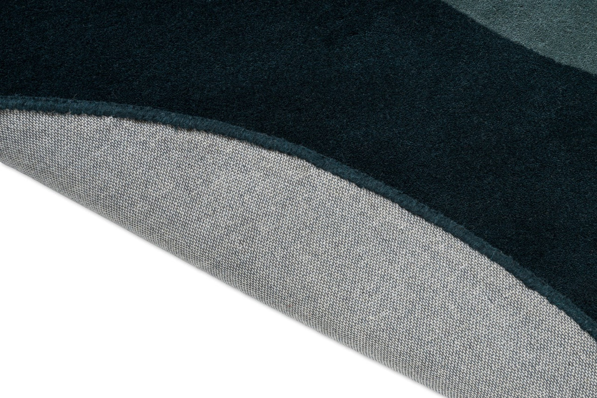 Brink & Campman Element Lane Blue tapijt, detail van omgeslagen rand en rug