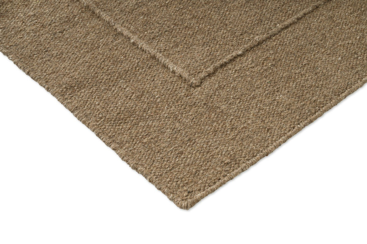 Brink & Campman Senso Border Fur Brown tapijt, detail van hoek en weefsel