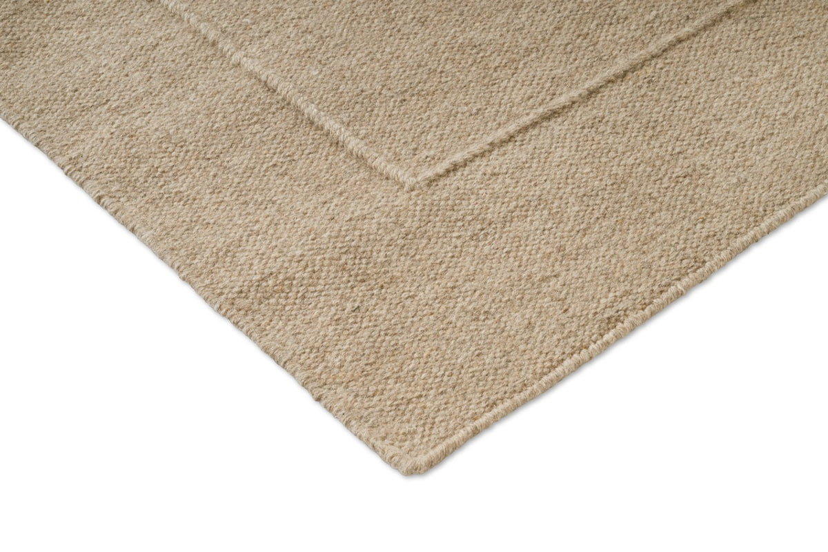 Brink & Campman Senso Border Natural tapijt, detail van hoek en weefsel