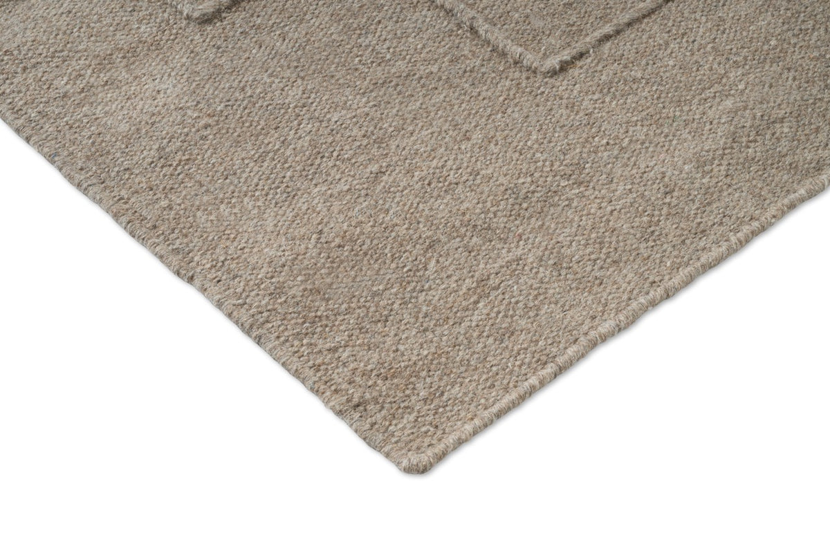 Brink & Campman Senso Level Soft Taupe tapijt, detail van hoek en weefsel