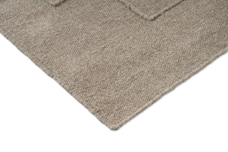 Brink & Campman Senso Level Soft Taupe tapijt, detail van hoek en weefsel