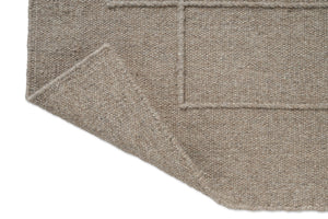 Brink & Campman Senso Level Soft Taupe tapijt, detail van omgeslagen hoek en achterzijde
