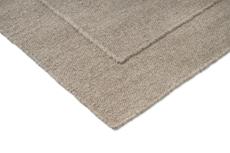 Brink & Campman Senso Planes Soft Taupe tapijt, detail van hoek en weefsel