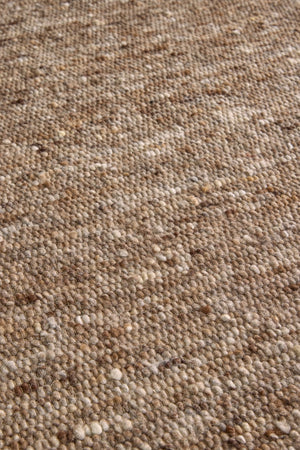 Brink & Campman Sober Soft Brown rug in mottled soft brown and taupe, shown in an interior, third view