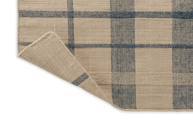 Detail shot of denim blue check pattern in flatwoven construction