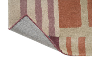 Tapis Harlequin Monolith Cinnabar Amber, détail de l'angle replié et du dos