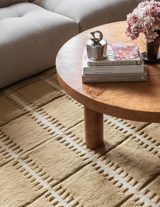 Detail edge of Layered Swedish Homage Lilly Mustard hand-woven wool rug