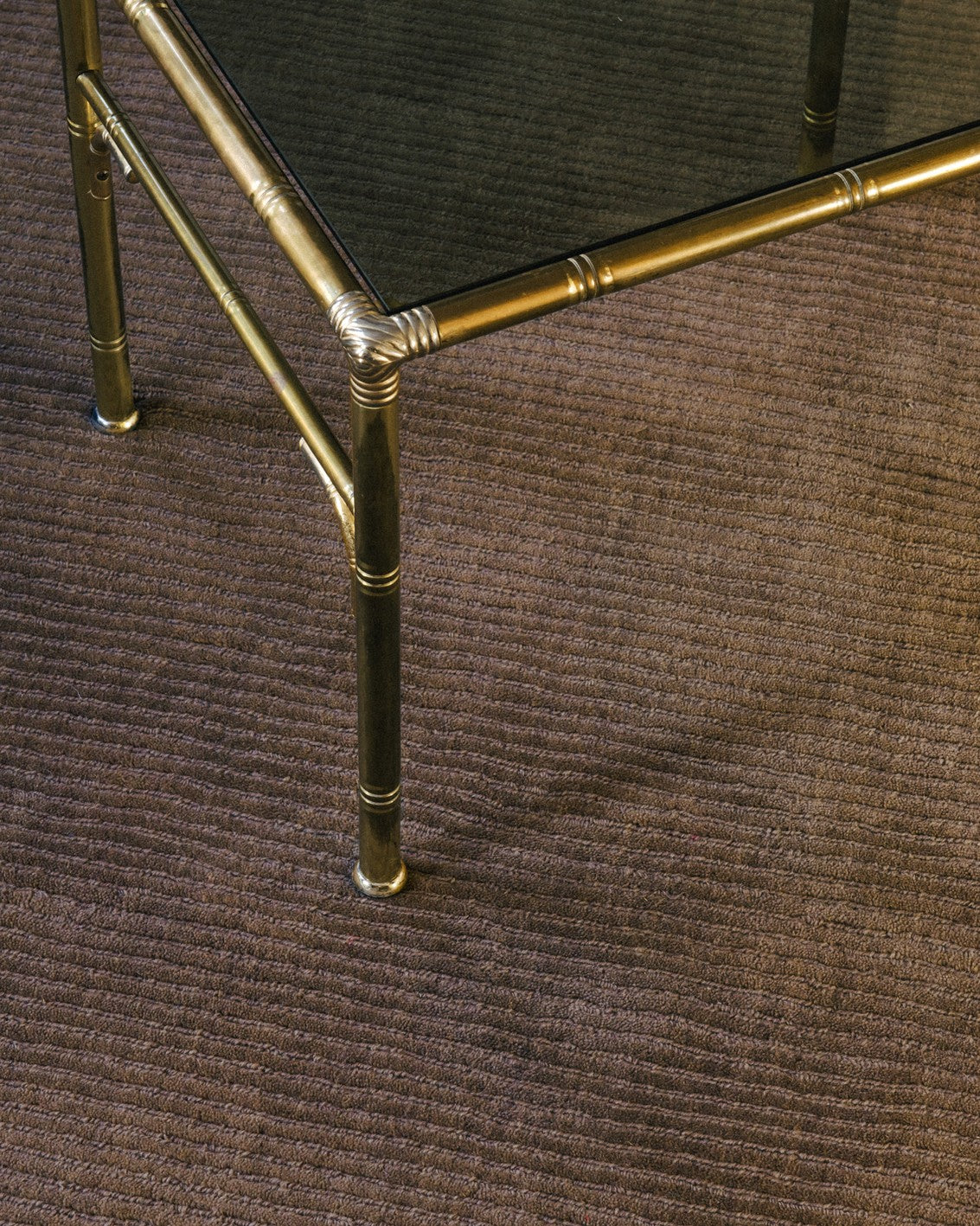 Layered Drift Wool Walnut walnut brown wool rug, close up in an interior