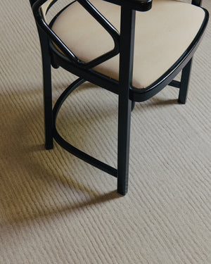 Layered Drift Wool Bone White white wool rug, close up in an interior