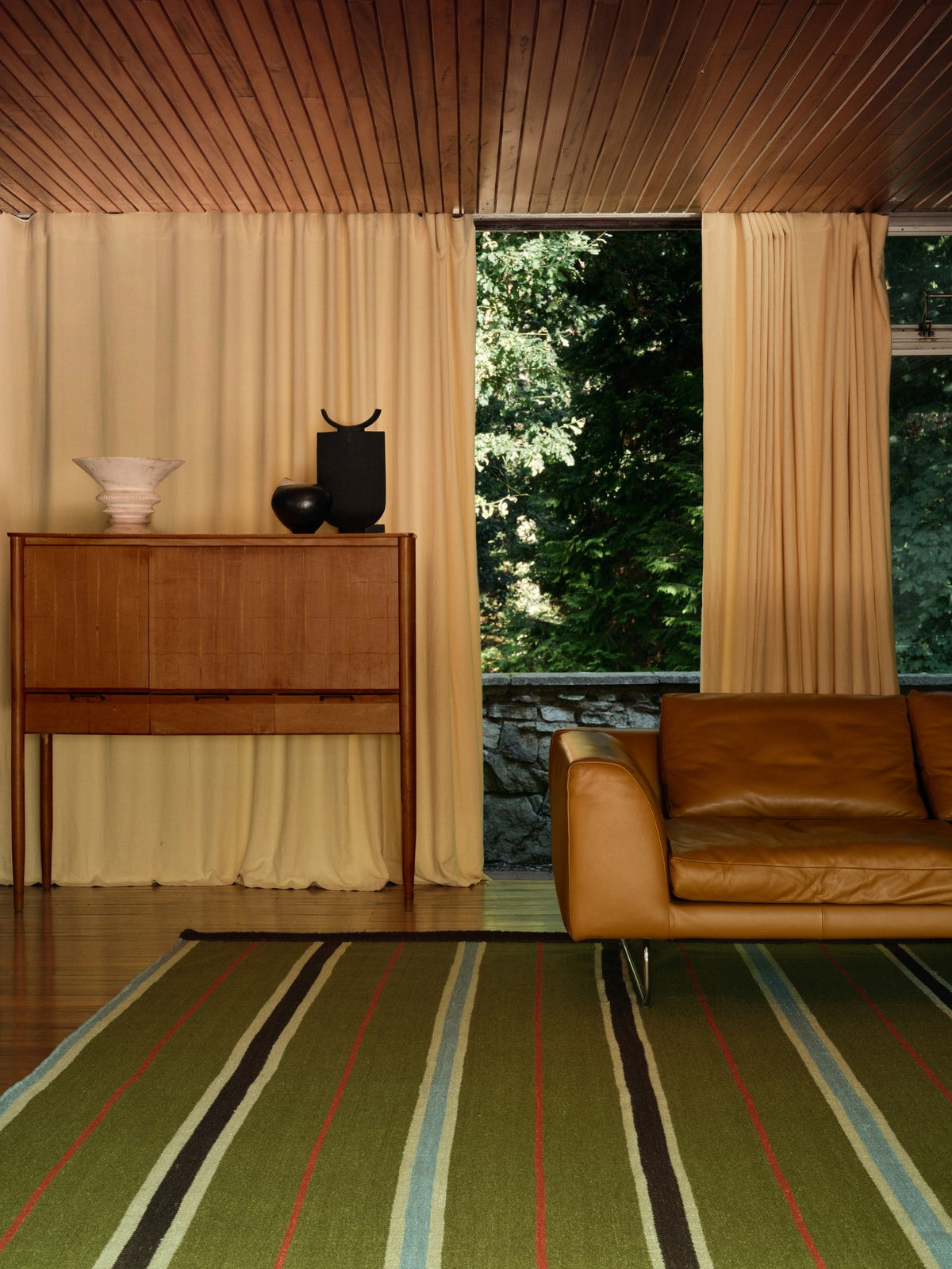 Layered x Tom Morris Racer Stripe Cooper Green flatweave wool rug, in a living room