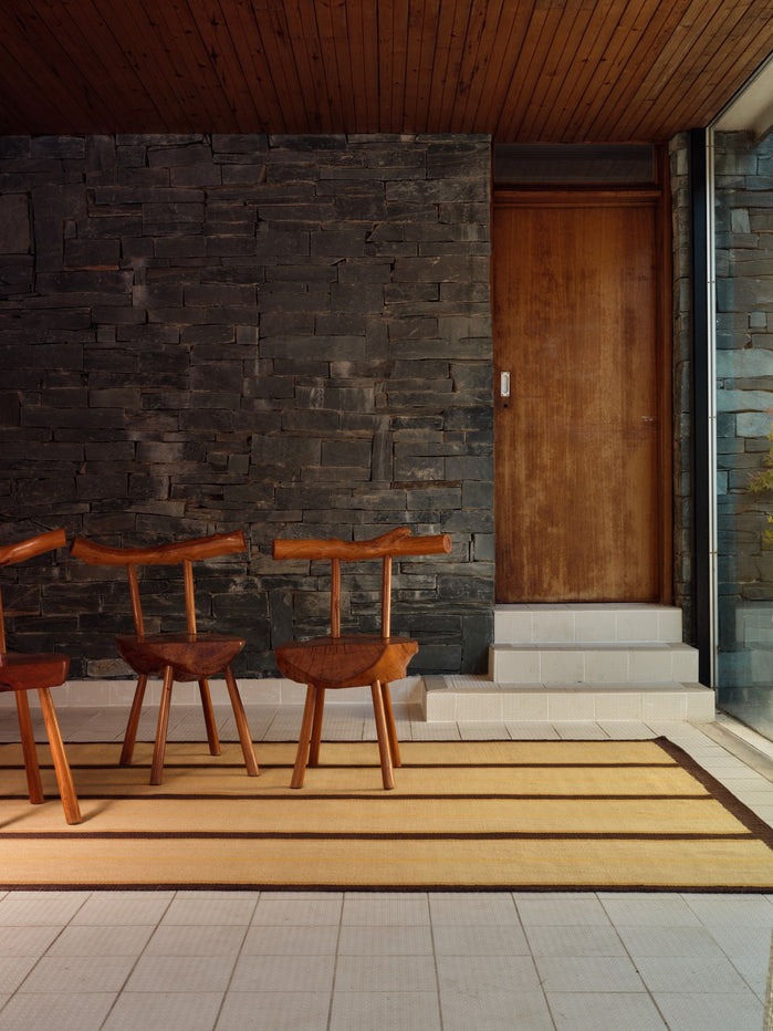 Layered x Tom Morris Racer Stripe Margarine flatweave wool rug, in an interior