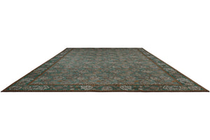 Morris & Co Theodosia Bottle Green rug in bottle green with caramel and ivory flowers, perspective view