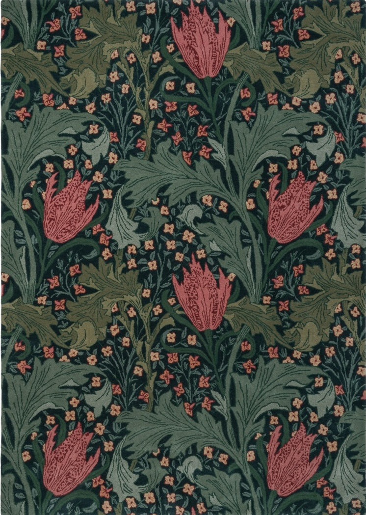 Morris & Co Lent Lily Indigo Madder rug in indigo with madder red tulips and sage leaves, top view