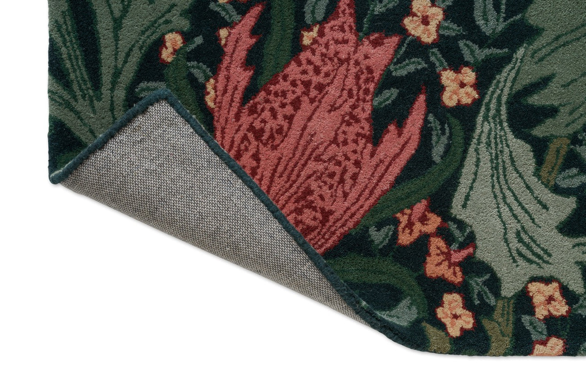 Morris & Co Lent Lily Indigo Madder rug, detail of folded corner and backing