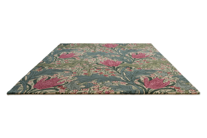 Morris & Co Lent Lily Plum Bayleaf rug in cream with plum tulips and bay green leaves, perspective view