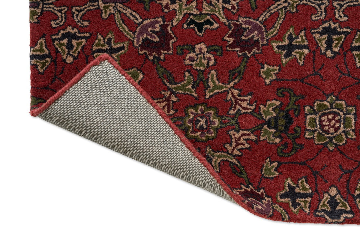 Morris & Co Persian Scroll Plum rug, detail of folded corner and backing