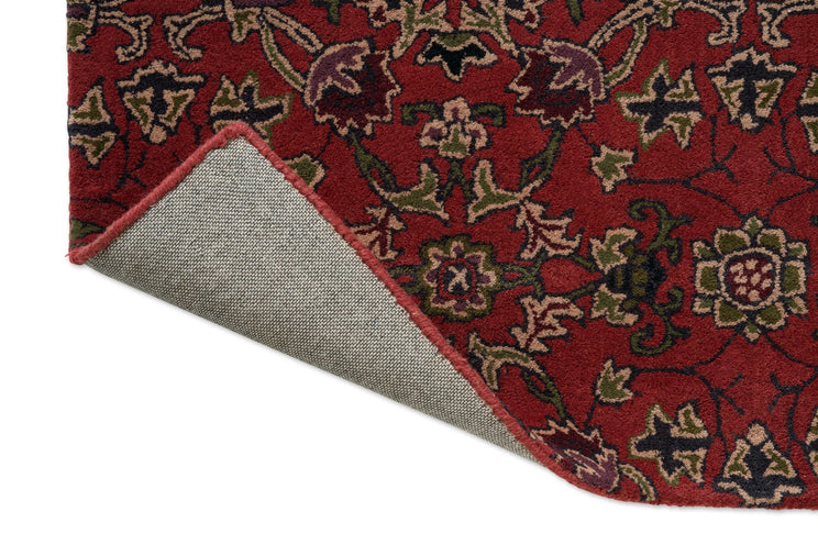 Morris & Co Persian Scroll Plum rug, detail of folded corner and backing