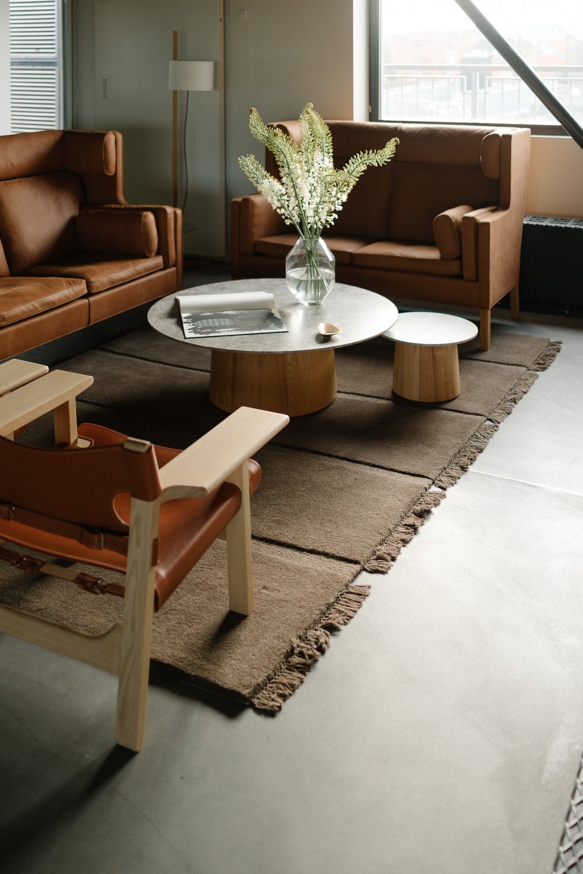 Massimo Atoll Brown hand tufted wool rug, shown in an interior