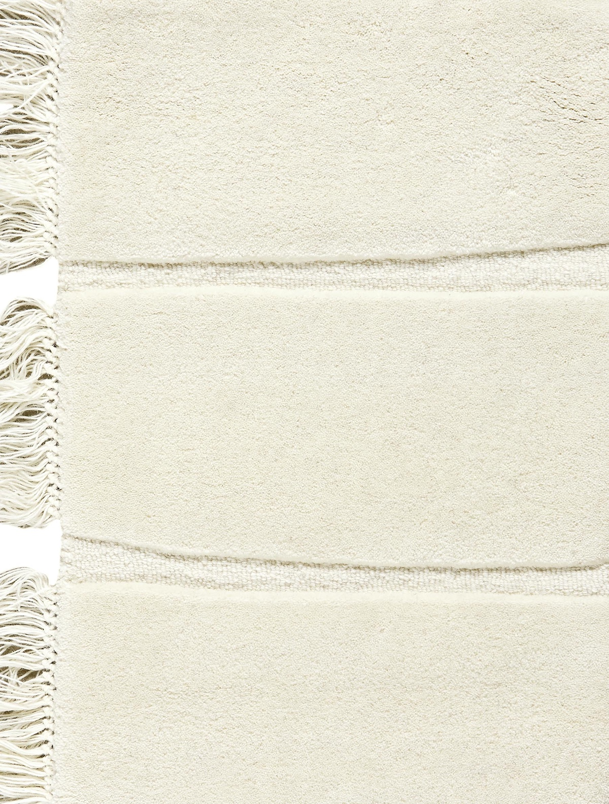 Massimo Atoll Cream handgetuft vloerkleed, detail van de franjes