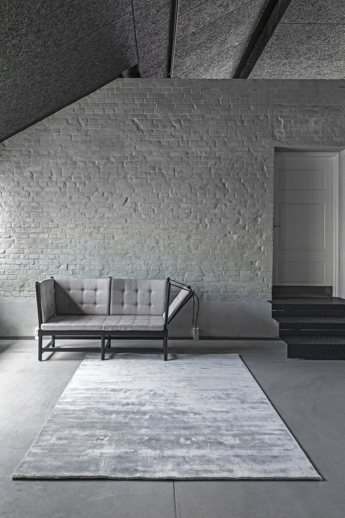 Massimo Earth Bamboo Concrete Grey wool rug, shown in an interior