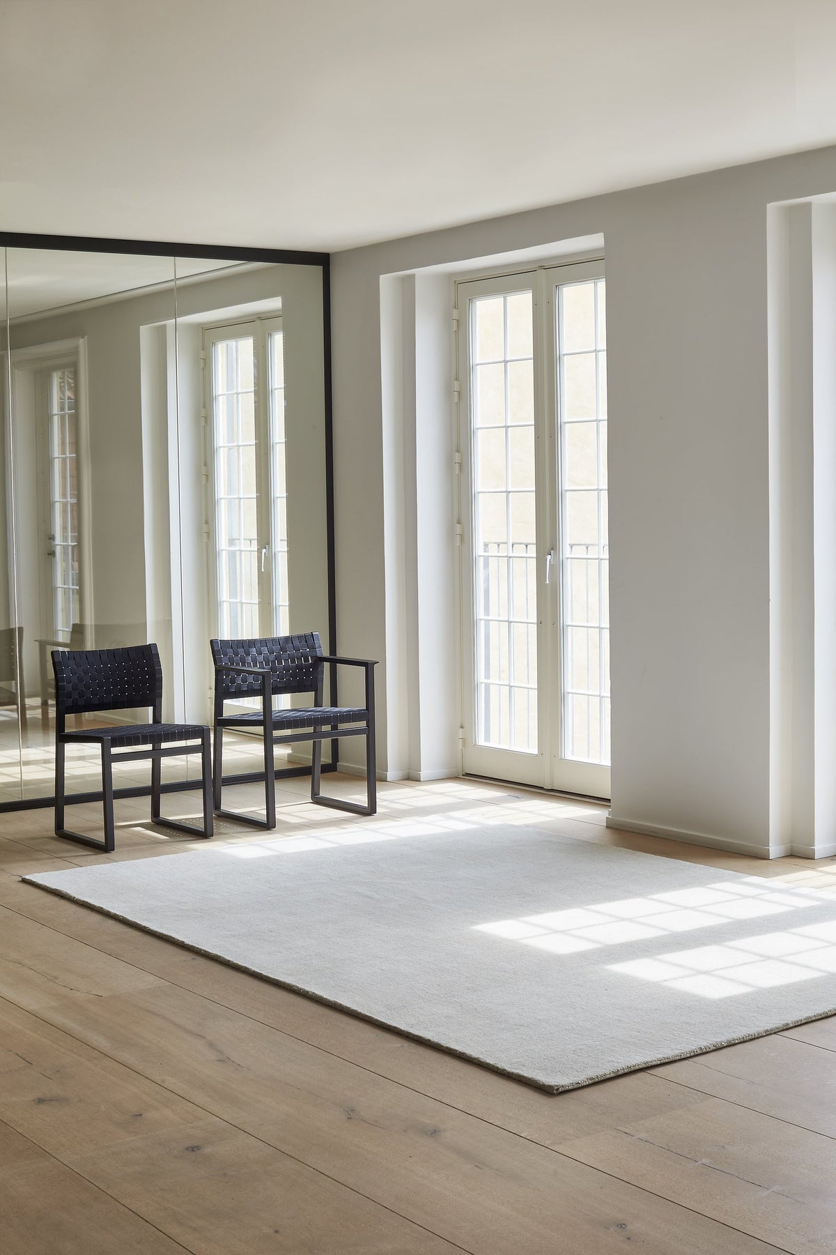Massimo Earth Natural Silver Grey wool rug, shown in an interior
