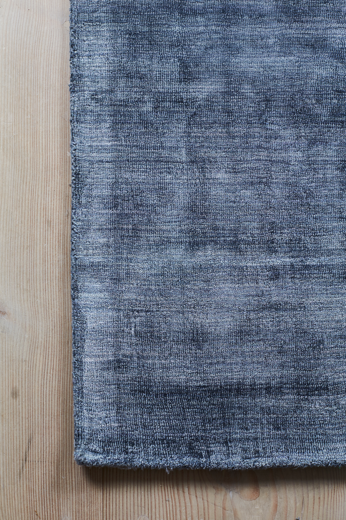 Massimo Karma Washed Blue bamboo silk rug, detail of the corner