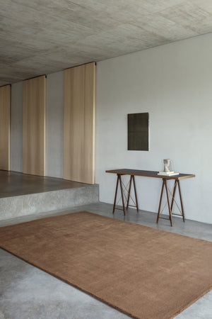 Massimo Karma Wool Dark Oak cognac rug, shown in an interior