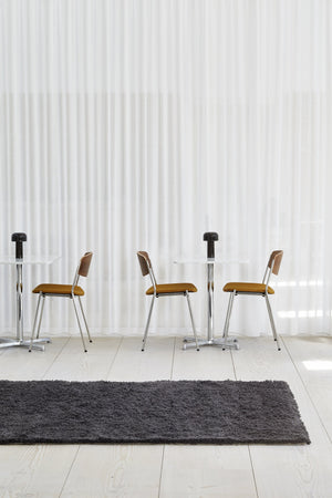 Massimo Rya Charcoal high pile wool rug, shown in an interior