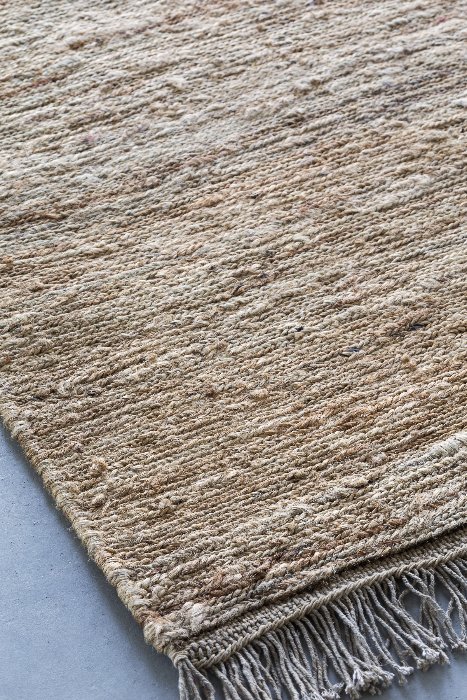 Massimo Sumace Natural fringed jute rug, perspective view